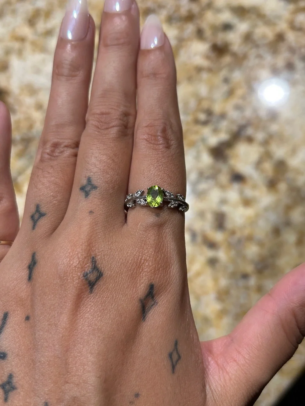 Sterling Silver Peridot Ring with Leaf Accent